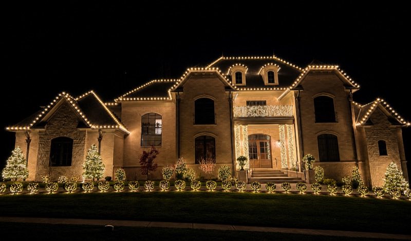 Full roofline and landscape holiday lighting on large estate